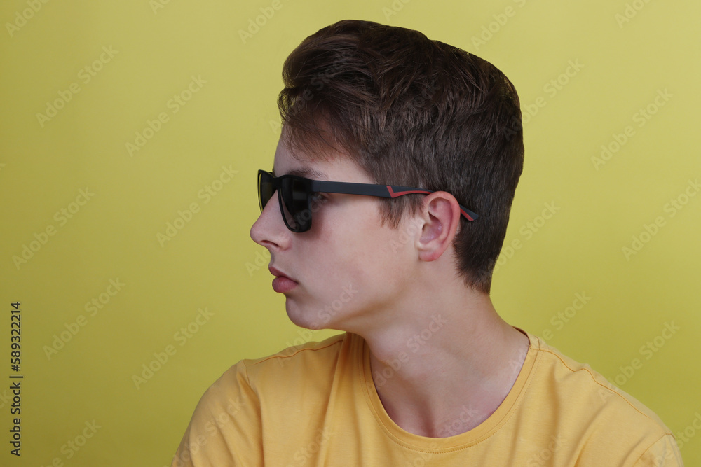 Fototapeta premium Stylish boy teenager close-up in glasses.