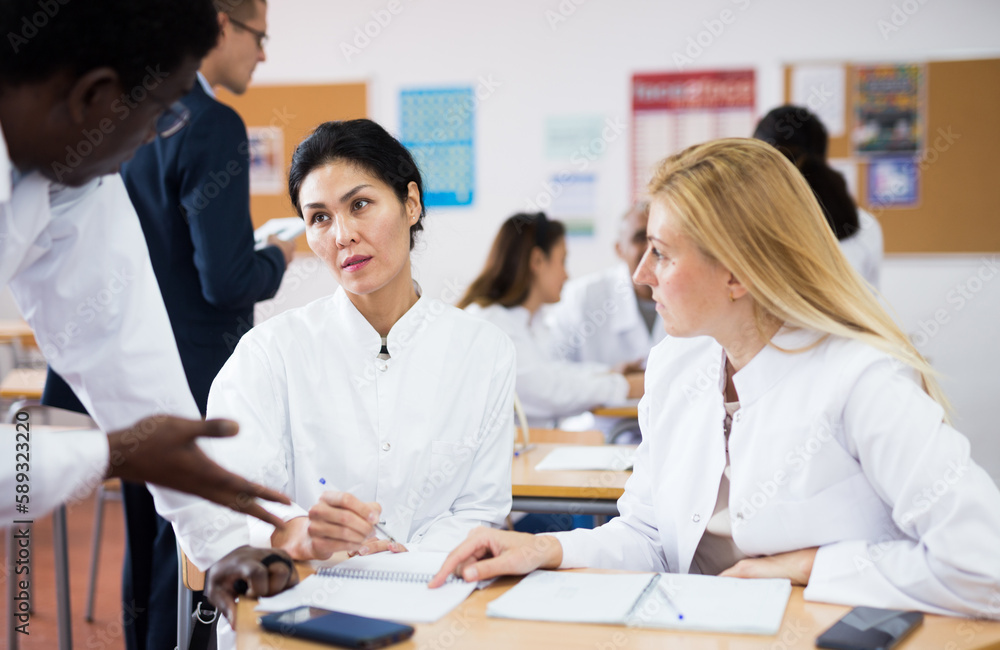 Fototapeta premium Medical academy students talking in class room