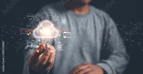 Wallpaper Mural Businessman holding lightbulb with virtual cloud computing for online document management, Innovation technology, Knowledge, Searching for new idea to development digital document system. Torontodigital.ca