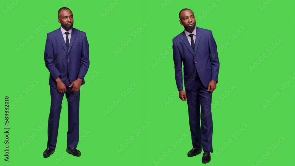Young adult checking hour on wristwatch and waiting in studio, looking at clock before working on business company. Startup entrepreneur in suit posing with confidence in studio. Young adult checking hour on wristwatch and waiting in studio, looking at clock before working on business company. Startup entrepreneur in suit posing with confidence in studio.