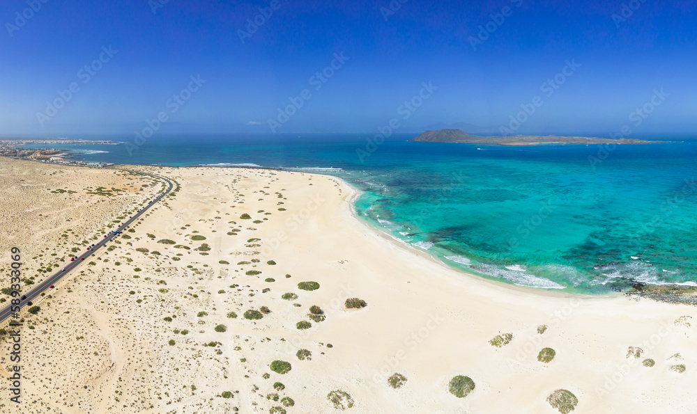 Beautiful high aspect aerial panoramic view of Flag Beach and Grandes Playa near Corralejo in Fuerteventura Spain Beautiful high aspect aerial panoramic view of Flag Beach and Grandes Playa near Corralejo in Fuerteventura Spain