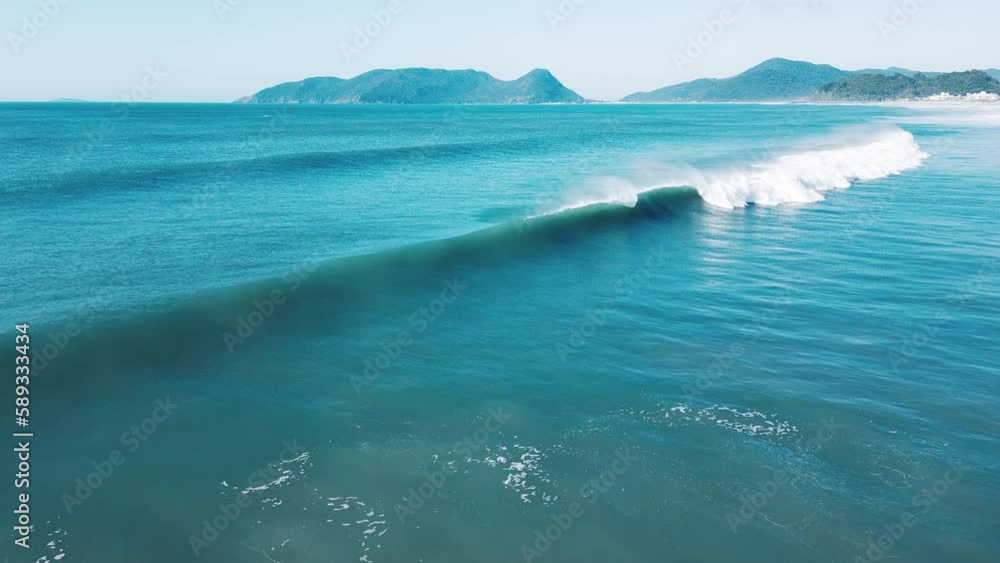 Aerial view of the perfect barrelling wave. Brazilian coastline of the Atlantic Ocean with waves. Morro das Pedras beach break Aerial view of the perfect barrelling wave. Brazilian coastline of the Atlantic Ocean with waves. Morro das Pedras beach break
