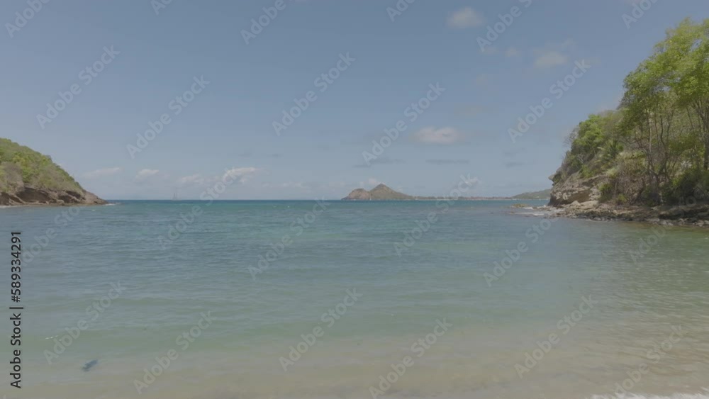 Flying over the tranquil waters off the coast of St. Lucia Flying over the tranquil waters off the coast of St. Lucia