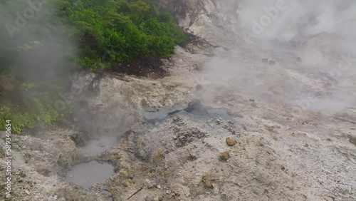 Plumes of steam rise above mud baths in Sulphur Springs St. Lucia