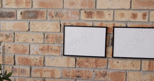 Wallpaper Mural Wooden frames with copy space on white background against brick wall Torontodigital.ca