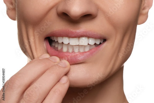 Woman showing healthy gums on white background, closeup