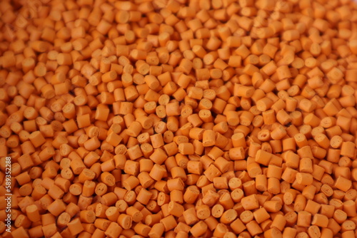 Orange pigment. Used for mixing with plastic pellets in production.