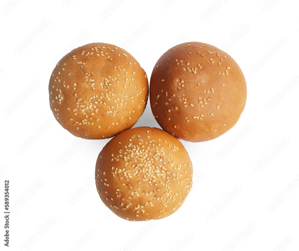 Fresh tasty buns with sesame seeds isolated on white, top view