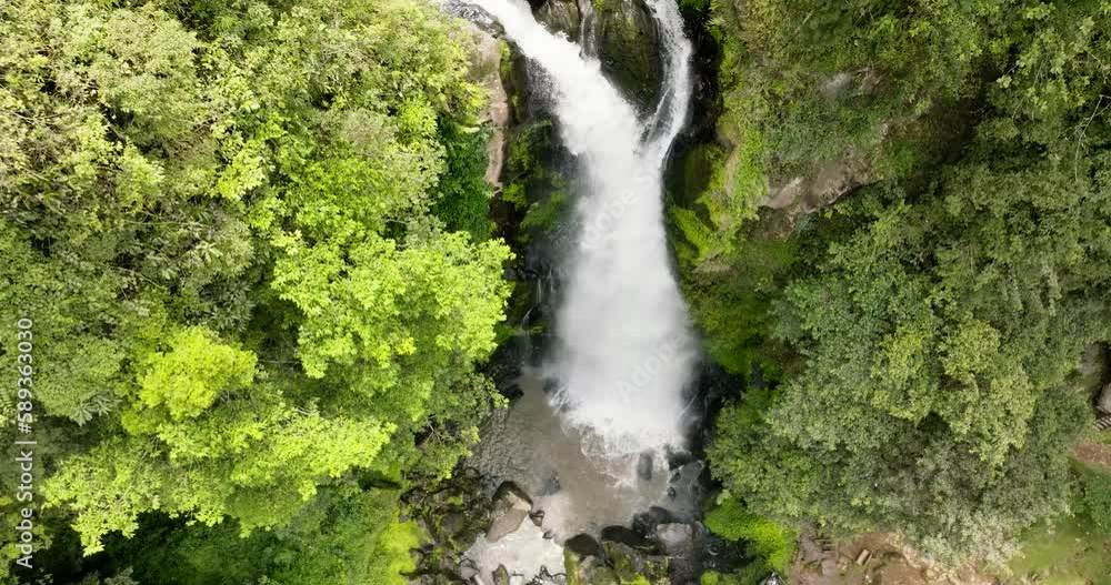 Aerial view of waterfall in the jungles. Sikulikap Falls in a mountain gorge. Sumatra, Indonesia.
