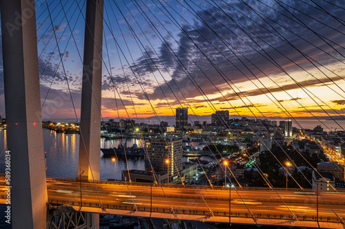 Aerial sunset view of Vladivostok city center and Golden horn bay with a famous bridge