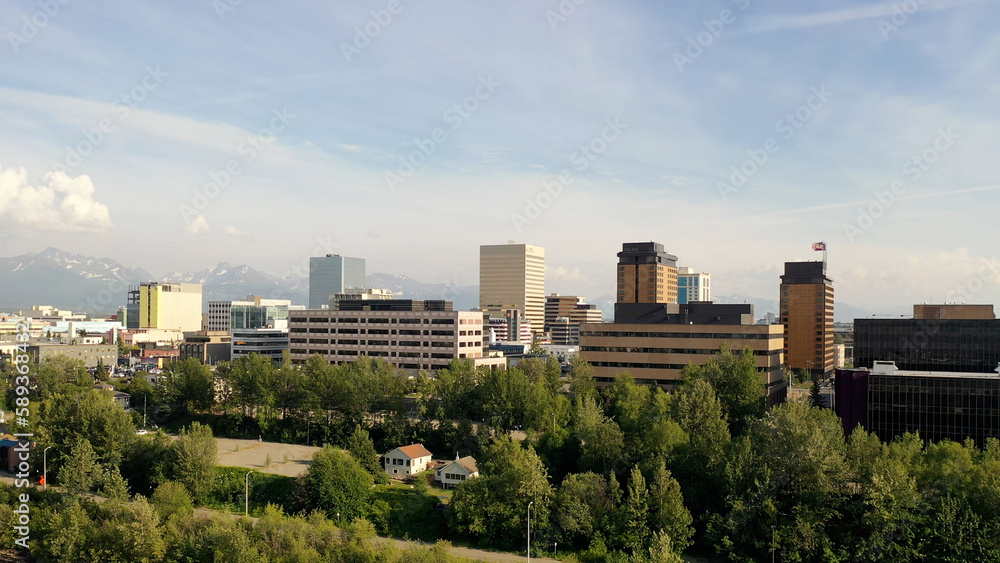 Aerial Establishing shot of downtown Anchorage, Alaska. Bird's eye view of commercial buildings. North America, city. Summer, sunny, day