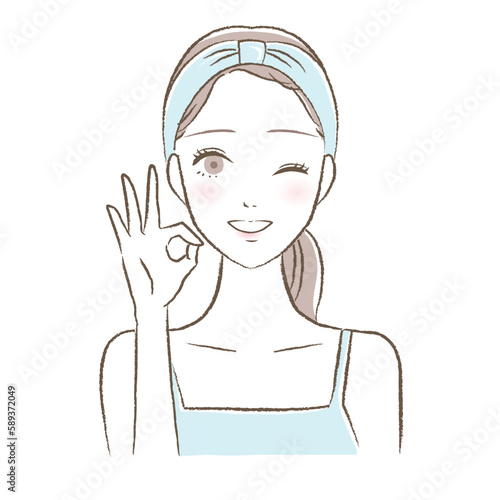 スキンケア・洗顔後にOKポーズをする若い女性のイラスト　ブルー