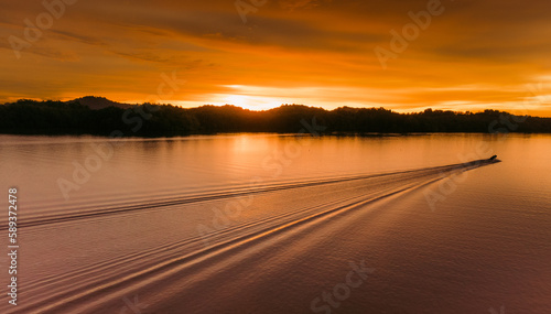 sunset over the river © hamizan