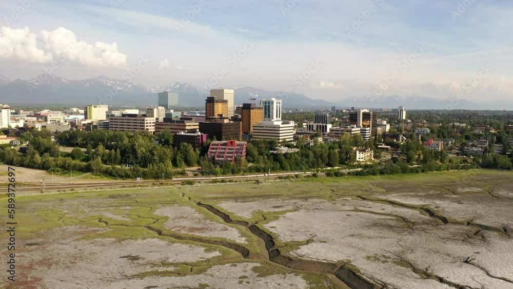 Aerial Establishing shot of downtown Anchorage, Alaska. Bird's eye view of commercial buildings. North America, city. Summer, sunny, day Aerial Establishing shot of downtown Anchorage, Alaska. Bird's eye view of commercial buildings. North America, city. Summer, sunny, day