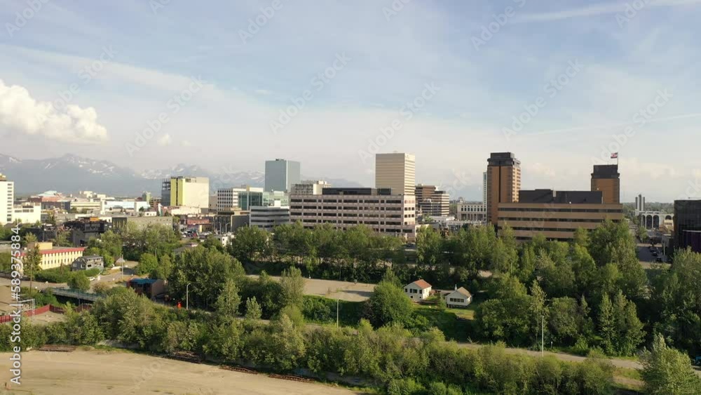 Aerial Establishing shot of downtown Anchorage, Alaska. Bird's eye view of commercial buildings. North America, city. Summer, sunny, day Aerial Establishing shot of downtown Anchorage, Alaska. Bird's eye view of commercial buildings. North America, city. Summer, sunny, day