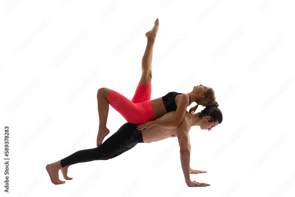 sport yoga couple on white studio background. photo of sport yoga couple training together. sport yoga couple on white studio background. photo of sport yoga couple training together.