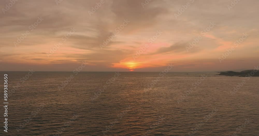 Static aerial view over the ocean at sunset. Tourism and travel concept. 4k video. Static aerial view over the ocean at sunset. Tourism and travel concept. 4k video.