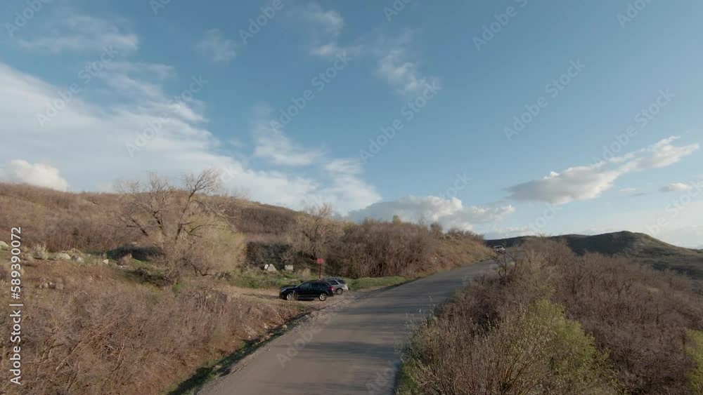 FPV view follow empty road near the peak of Mount Timpanogos located in the Utah Wasatch, USA. FPV view follow empty road near the peak of Mount Timpanogos located in the Utah Wasatch, USA.