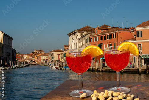 spritz for two in Venice with canal and traditional houses