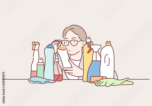 Woman scans the composition of Detergent. Hand drawn style vector design illustrations.