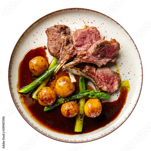 Portion of gourmet racks of lamb with potato and asparagus