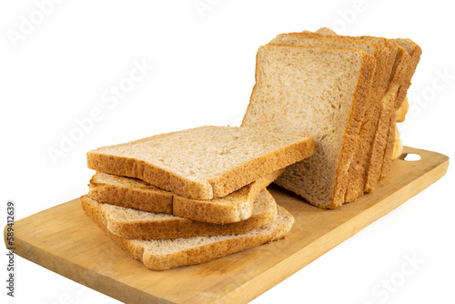 Vászonkép Sliced wheat bread served on a wooden cutting board