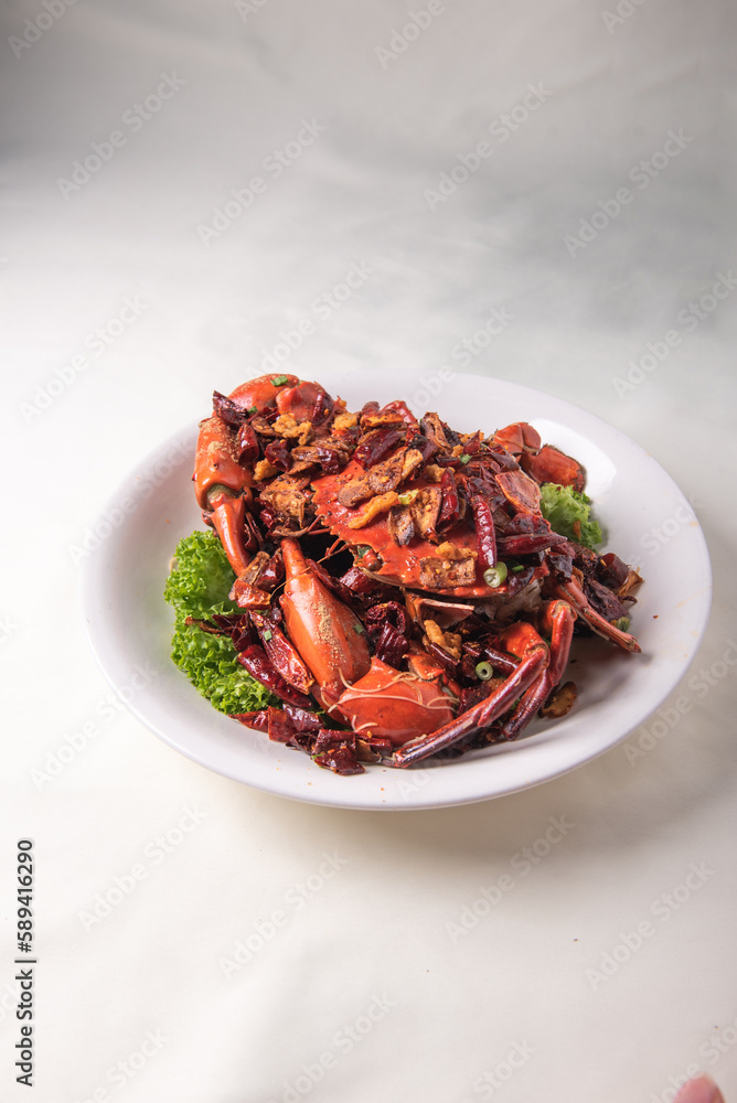 local wok fried Sri Lanka big fresh live crab with spicy onion garlic chilli salted egg yolk white pepper sauce vermicelli on wood table asian chinese halal food banquet seafood menu for restaurant local wok fried Sri Lanka big fresh live crab with spicy onion garlic chilli salted egg yolk white pepper sauce vermicelli on wood table asian chinese halal food banquet seafood menu for restaurant