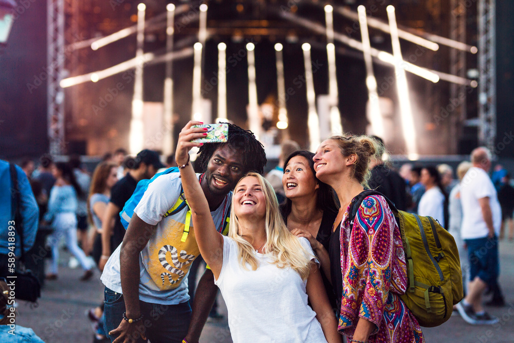 Friends taking selfie at music concert Friends taking selfie at music concert