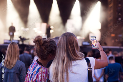 Friends having fun at music concert