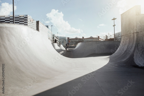 Man skateboarding in skate park