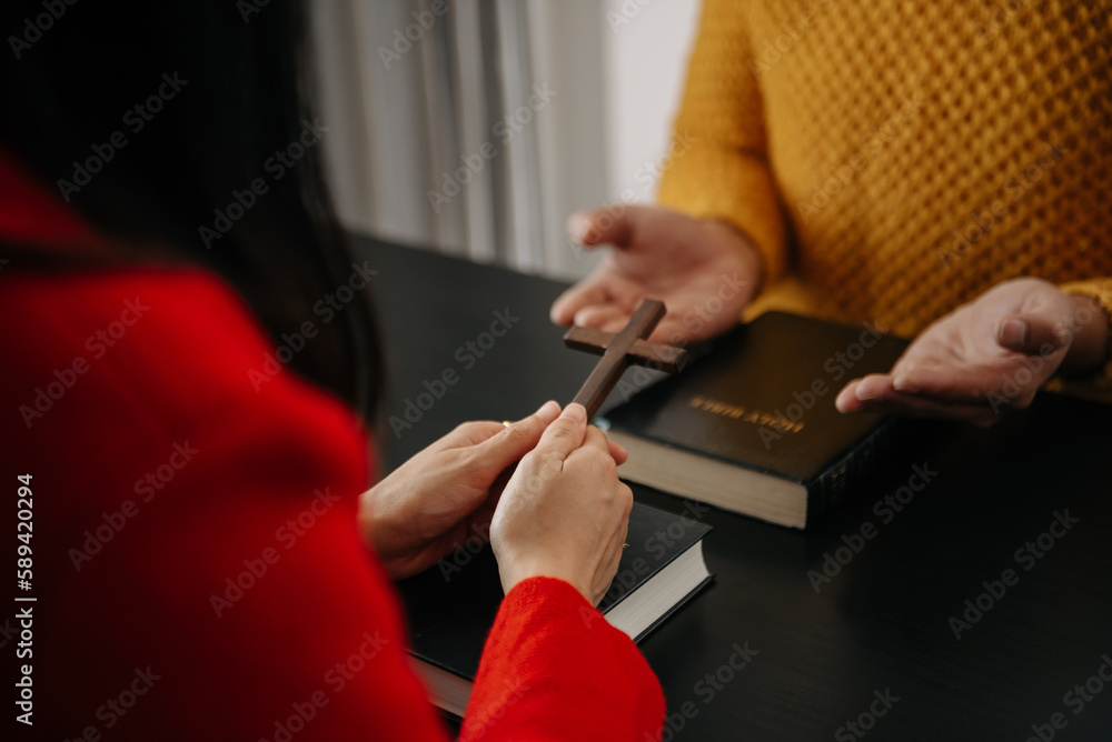 Obraz premium Christians are congregants join hands to pray and seek the blessings of God, the Holy Bible.Study the Word of God