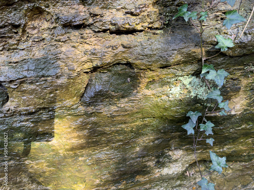 Natural spring formation of water percolating through sandstone.