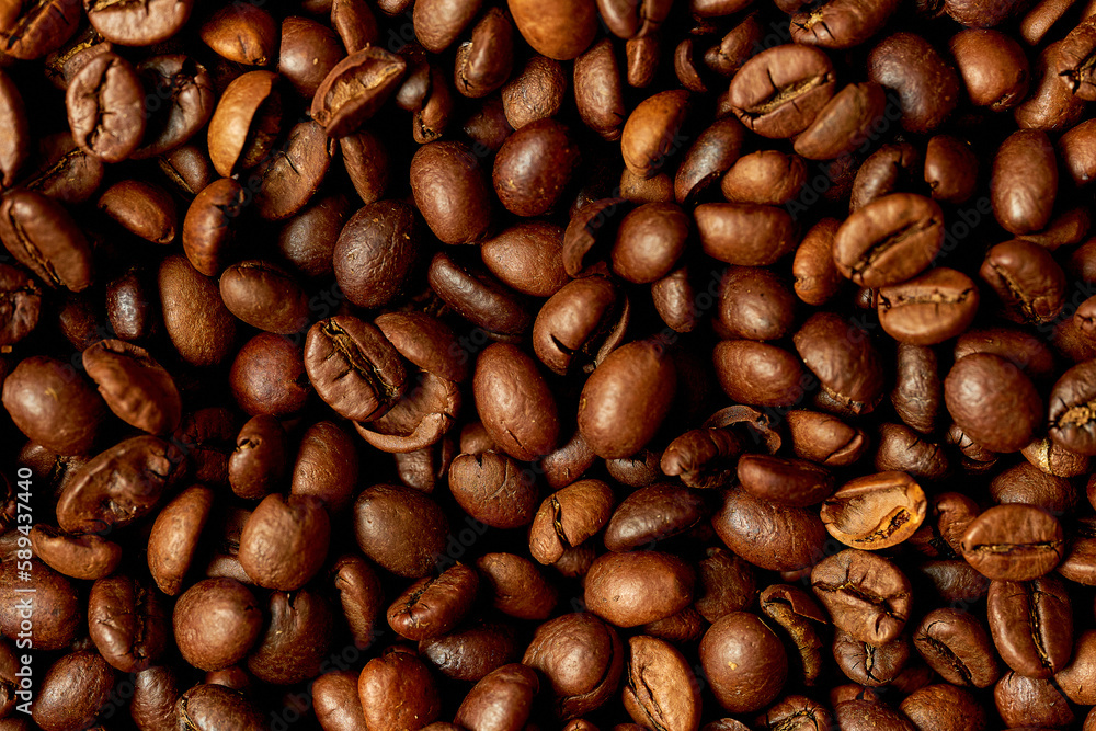 Naklejka premium Close-up of roasted coffee beans. Pattern