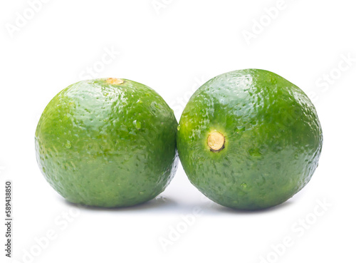 Two green lemon fruits with some drop on them isolated on white background with clipping path and shadow in png format