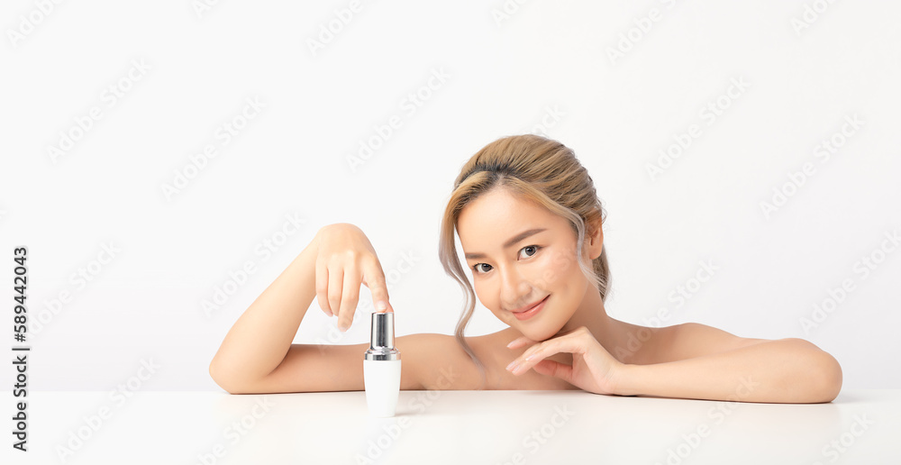 Happy beautiful young asian woman holding cosmetic cream blank bottle, Fashion model, Health wellness, Beautiful girl skin care and facial treatment. Isolated on white background. Happy beautiful young asian woman holding cosmetic cream blank bottle, Fashion model, Health wellness, Beautiful girl skin care and facial treatment. Isolated on white background.