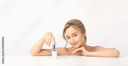 Happy beautiful young asian woman holding cosmetic cream blank bottle  Fashion model  Health wellness  Beautiful girl skin care and facial treatment. Isolated on white background.