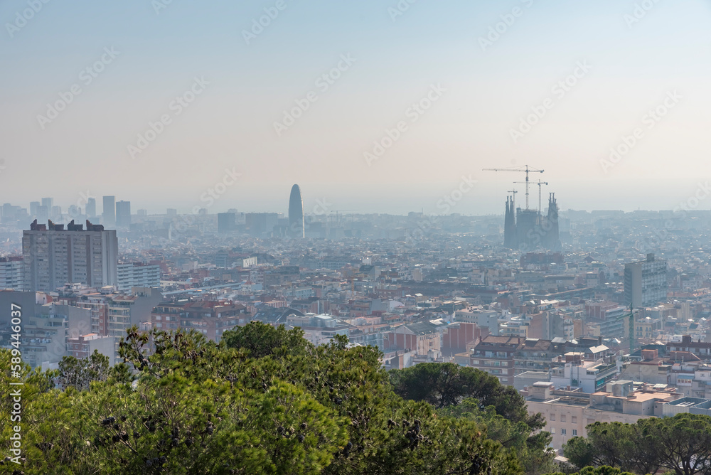 Sunrise and city of Barcelona from Tibidabo hill with city lights
