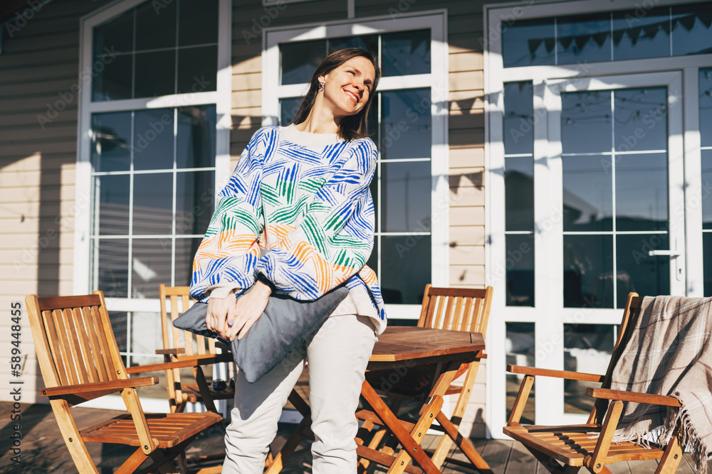 Portrait of young smiling woman looking at camera with crossed arms. Happy girl standing in creative office. Successful businesswoman standing in office with copy space. Portrait of young smiling woman looking at camera with crossed arms. Happy girl standing in creative office. Successful businesswoman standing in office with copy space.