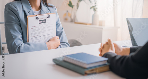 Young woman submit resume employer to review job application. Concept presents ability for the company to agree with position of the job.
