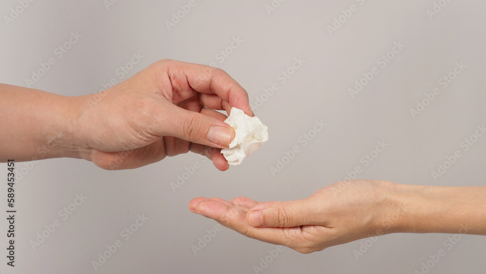Hands send tissue paper on black background. Hands send tissue paper on black background.