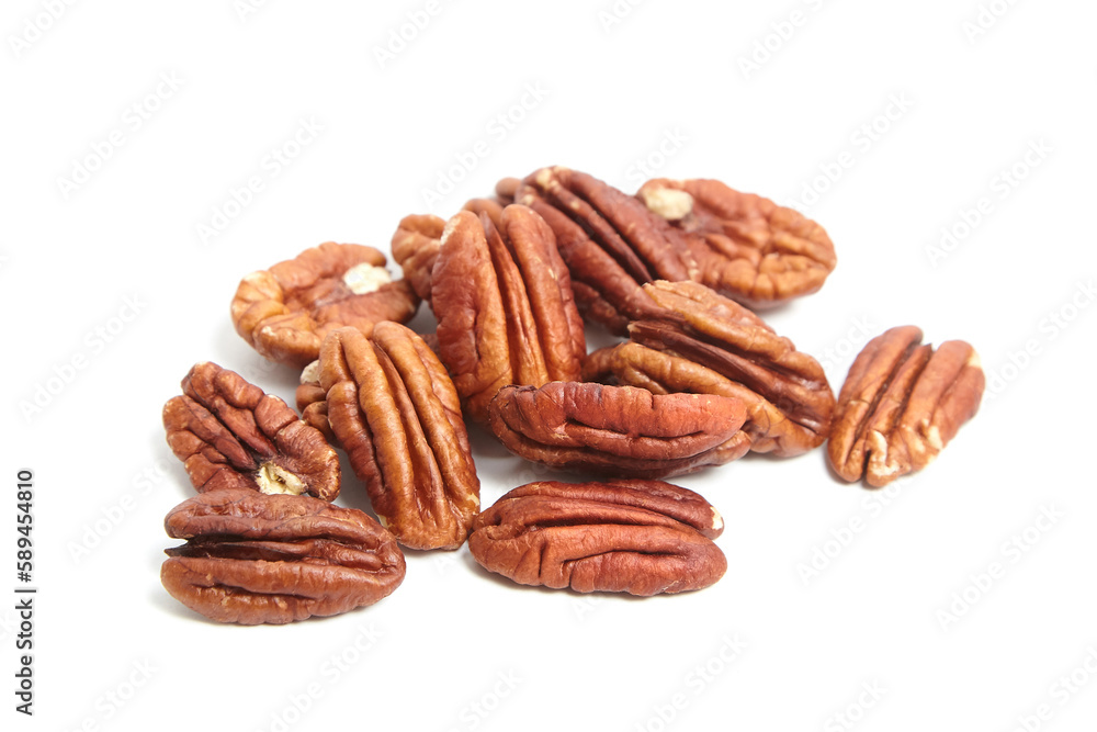 Peeled pecan nuts isolated on a white background. Heap of pecan halves Peeled pecan nuts isolated on a white background. Heap of pecan halves