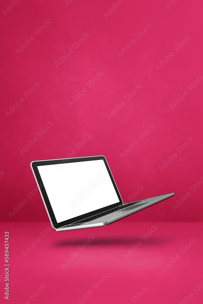 Floating computer laptop isolated on pink. Vertical background Floating computer laptop isolated on pink. Vertical background