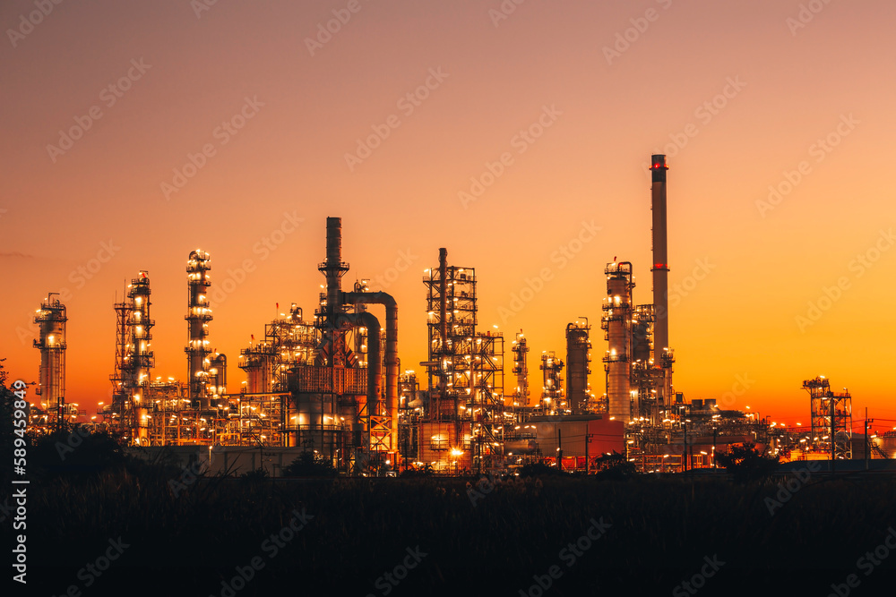 Scene of the oil refinery plant of petrochemistry Oil​ refinery​ and​ plant and flue smoke industry in oil​ and​ gas​ ​industry with​ cloud​ red and orange ​sky the morning​