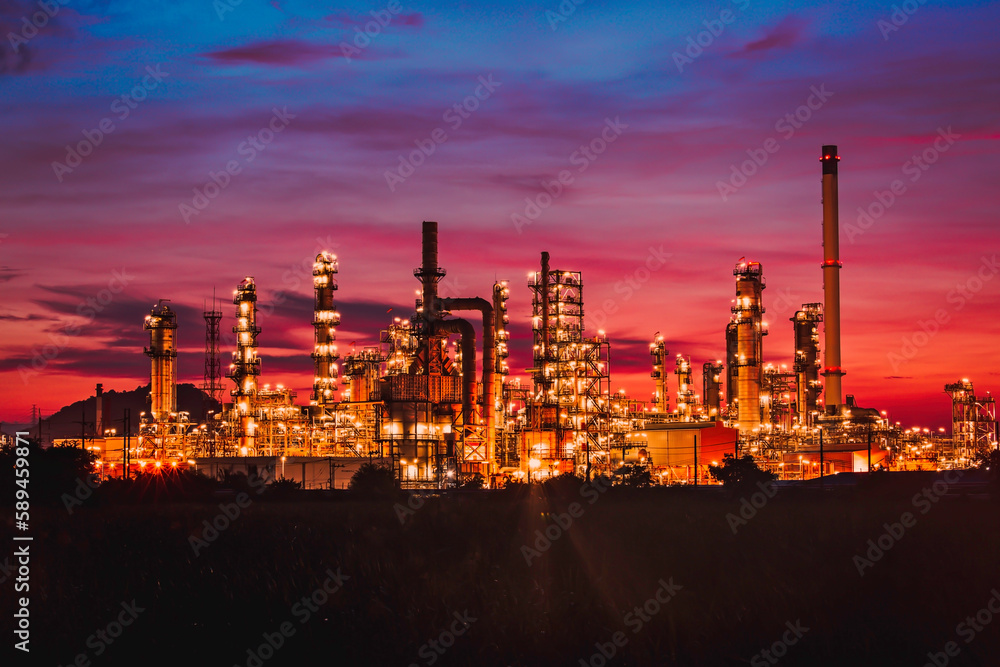 Scene of the oil refinery plant of petrochemistry Oil​ refinery​ and​ plant and flue smoke industry in oil​ and​ gas​ ​industry with​ cloud​ red and orange ​sky the morning​