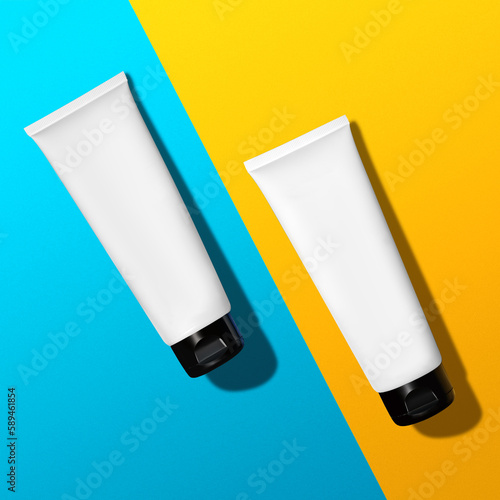 Hand cream product for skincare concept. Pure cosmetic packages on a blue and yellow background. Ukranian flag.