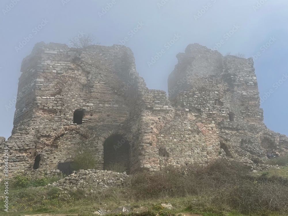 Ancient fortress in the fog - stock photo