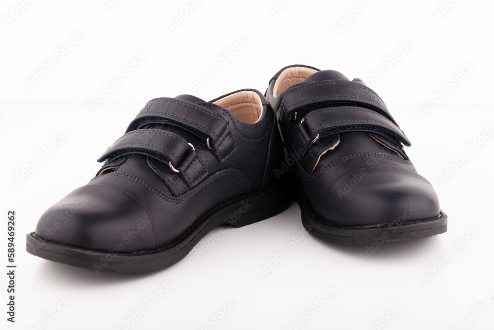 A pair of black leather shoes on a white background.