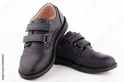 Wallpaper Mural A pair of black leather shoes on a white background. Torontodigital.ca