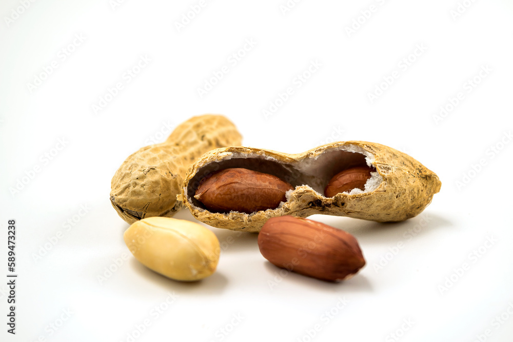 Dried peanuts in closeup on white Dried peanuts in closeup on white