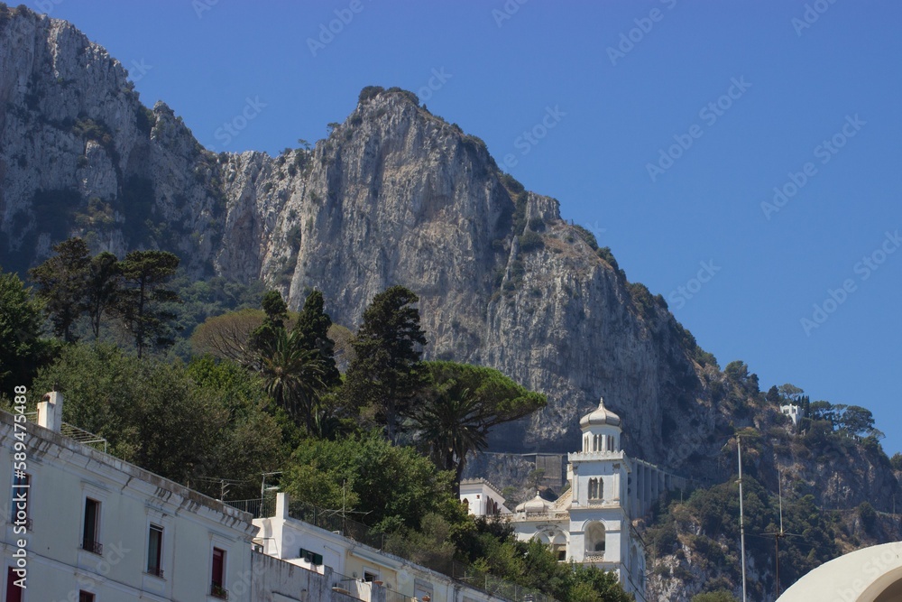 Beautiful view of white buildings and rocks on Capri Island, Naples, Italy